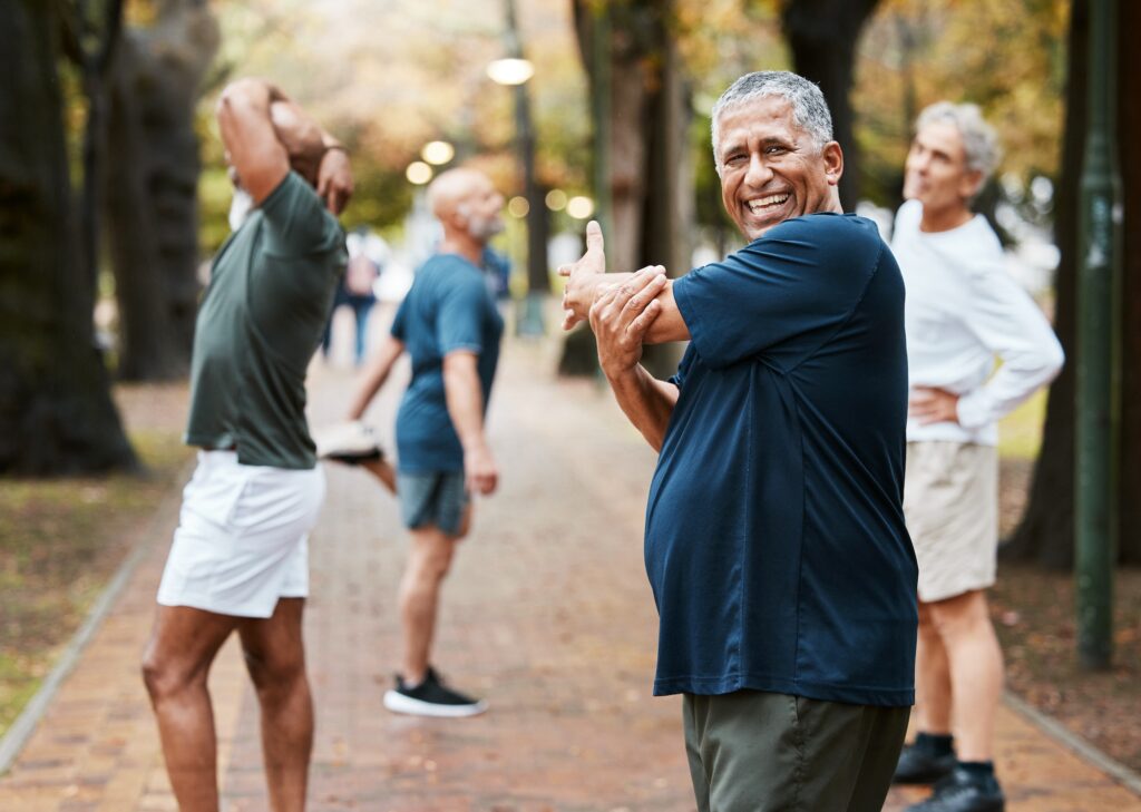 Fitness, friends and stretching with old man in park for training, health and wellness. Retirement,